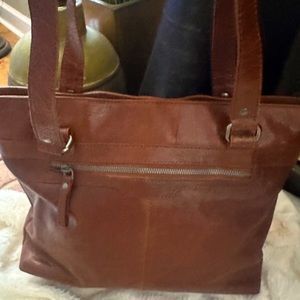 Spikes and sparrow tote with padded laptop area you can take of if not need.